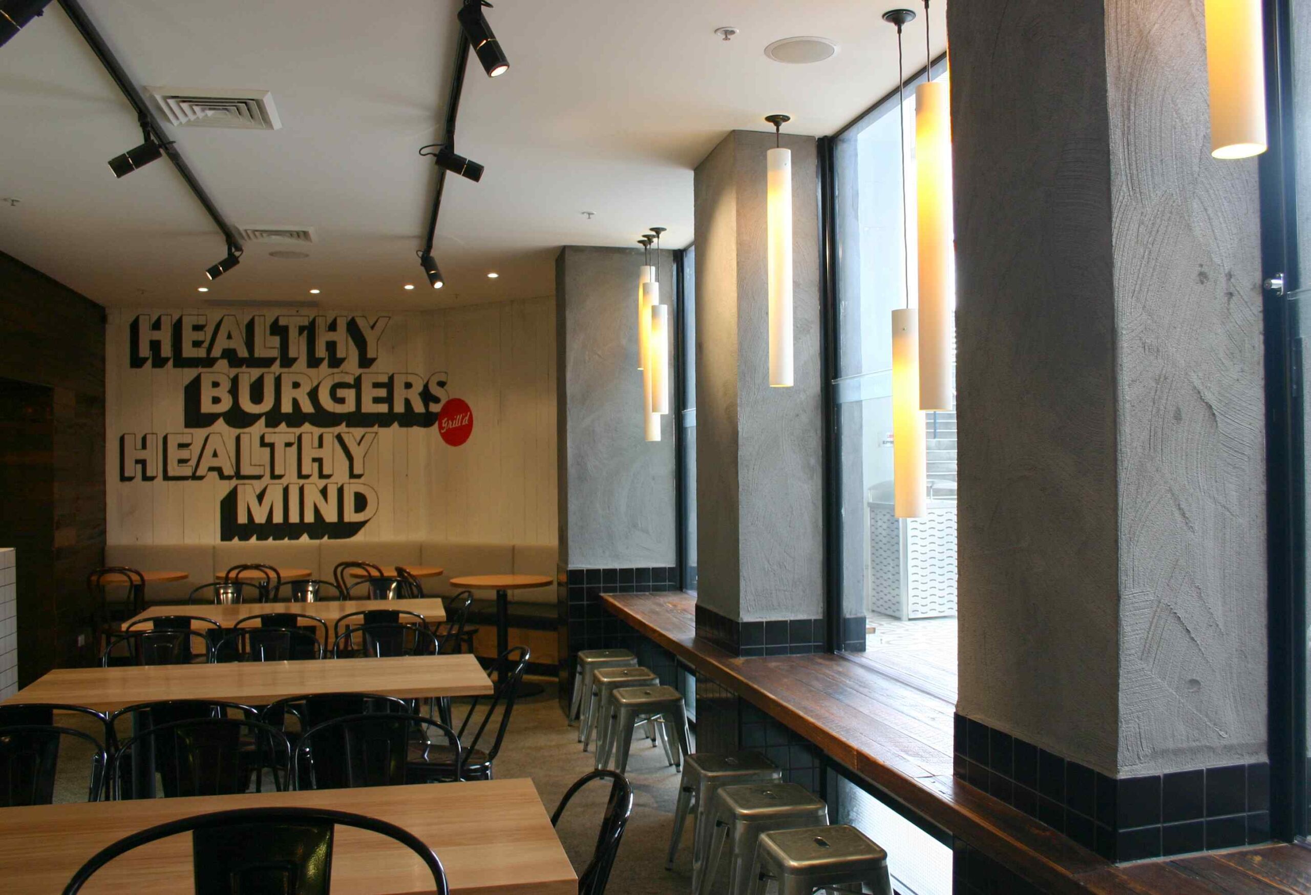 Grilld Restaurant Seating area in Darlinghurst Sydney facing Window and grey pillars